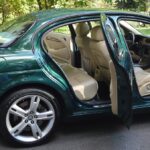 Analyzing the Impact of In-Car Audio Emotional Wellbeing Programs